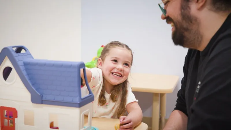 Therapist and child playing together during ABA therapy session